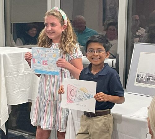 The-Junior-Commadores-explaining-their-renditions-of-our-two-club-burgees